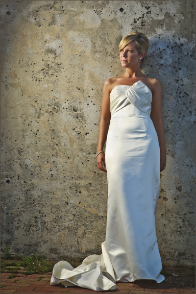 Bride leaning again wall in downtown Halifax