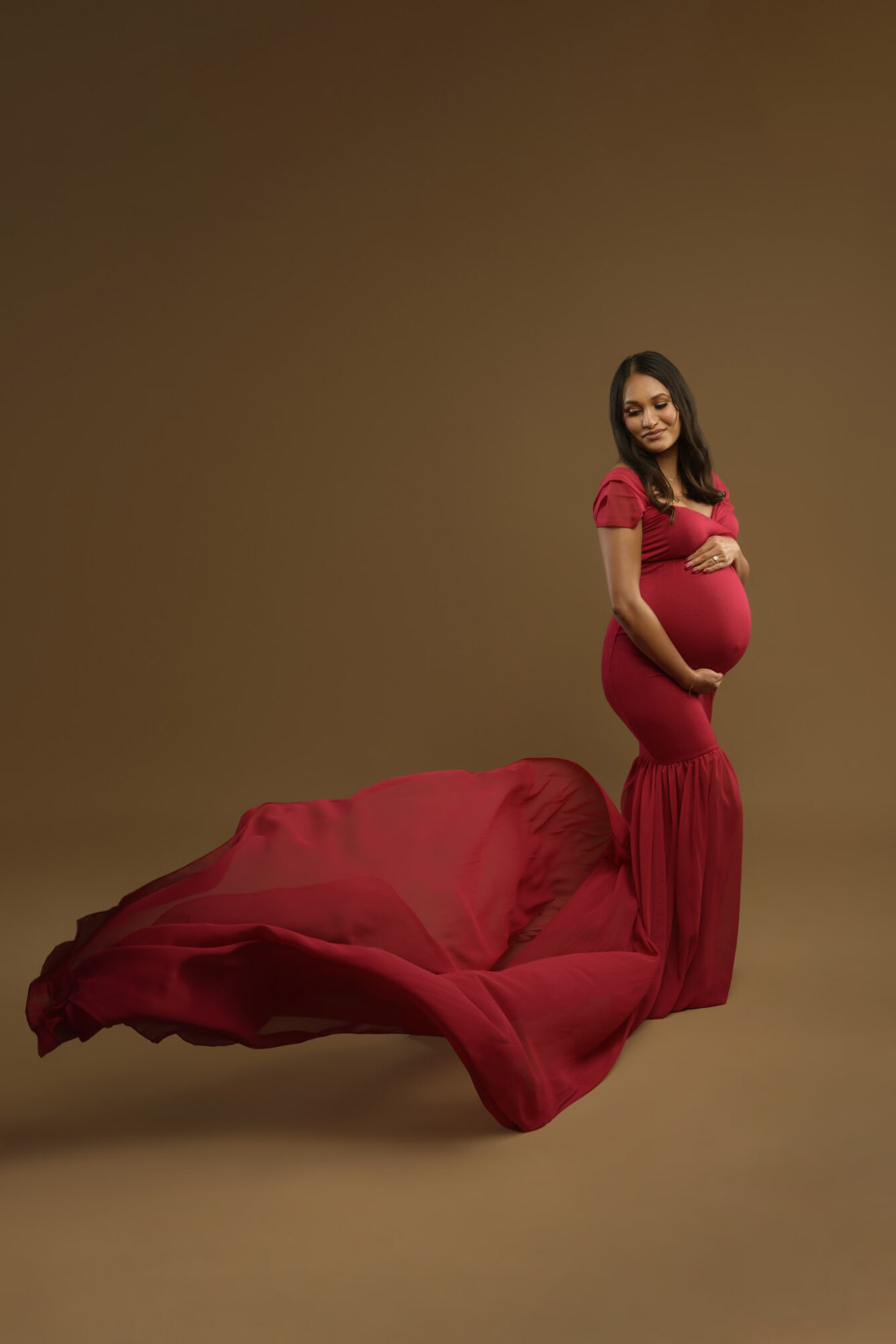 red mermaid style maternity photo shoot dress