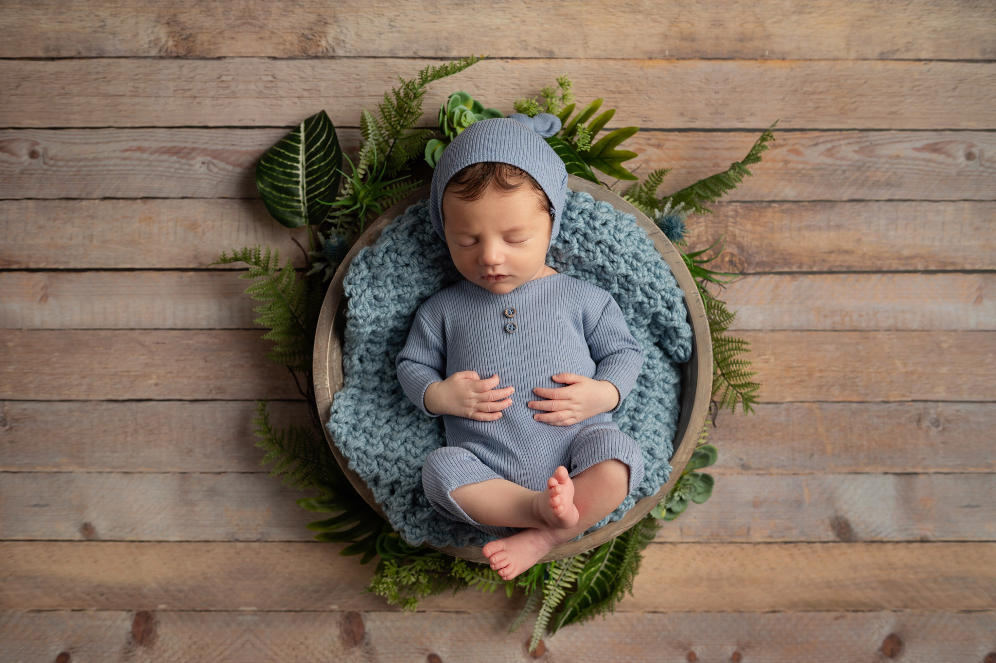 Newborn baby boy studio portrait
