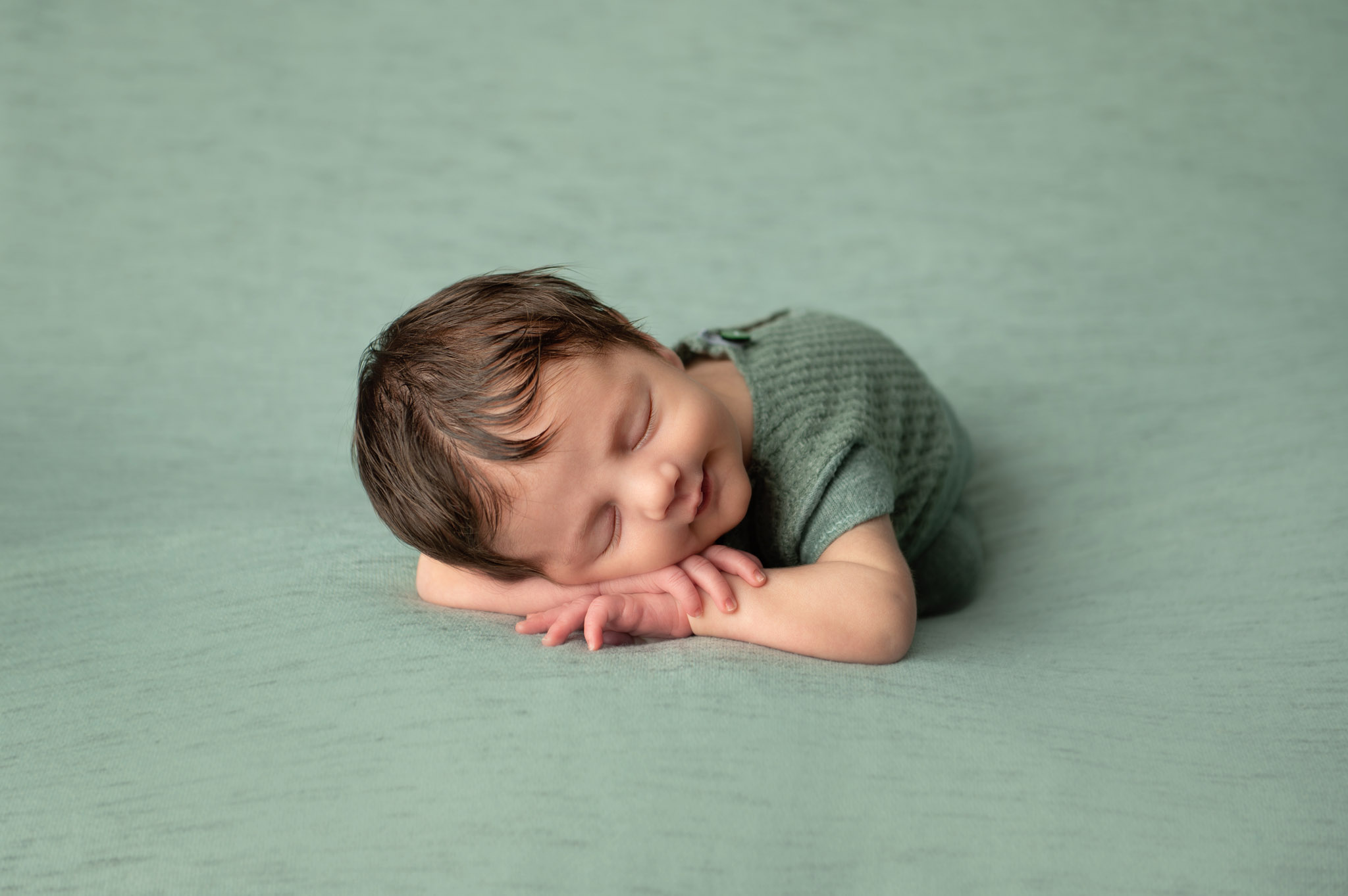 Newborn photography on green