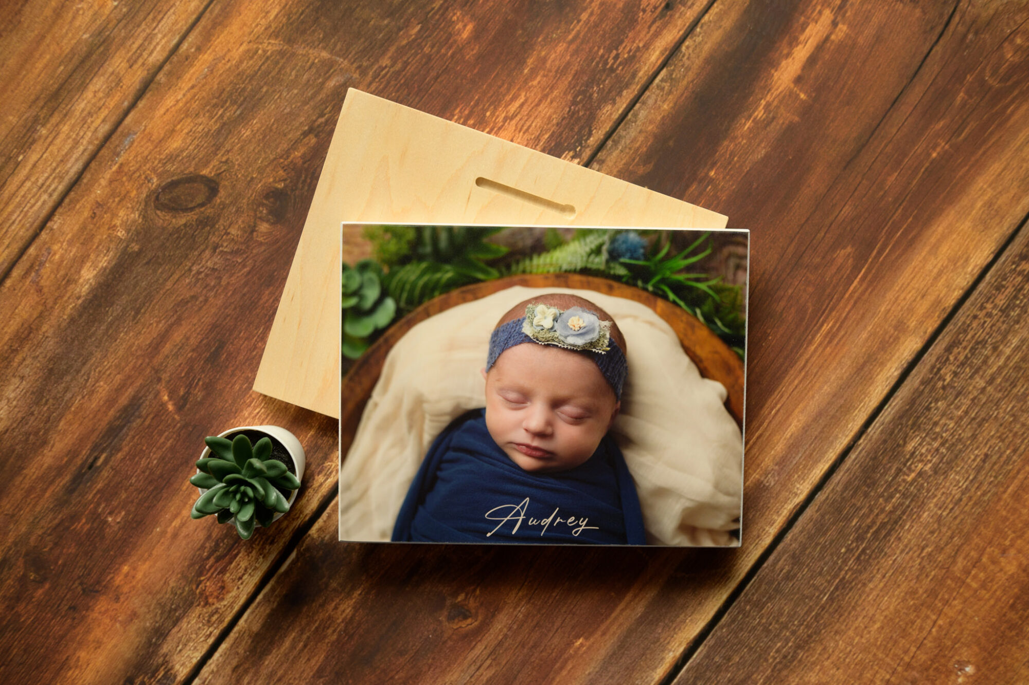 photo of newborn baby girl printed on a wood photo mount