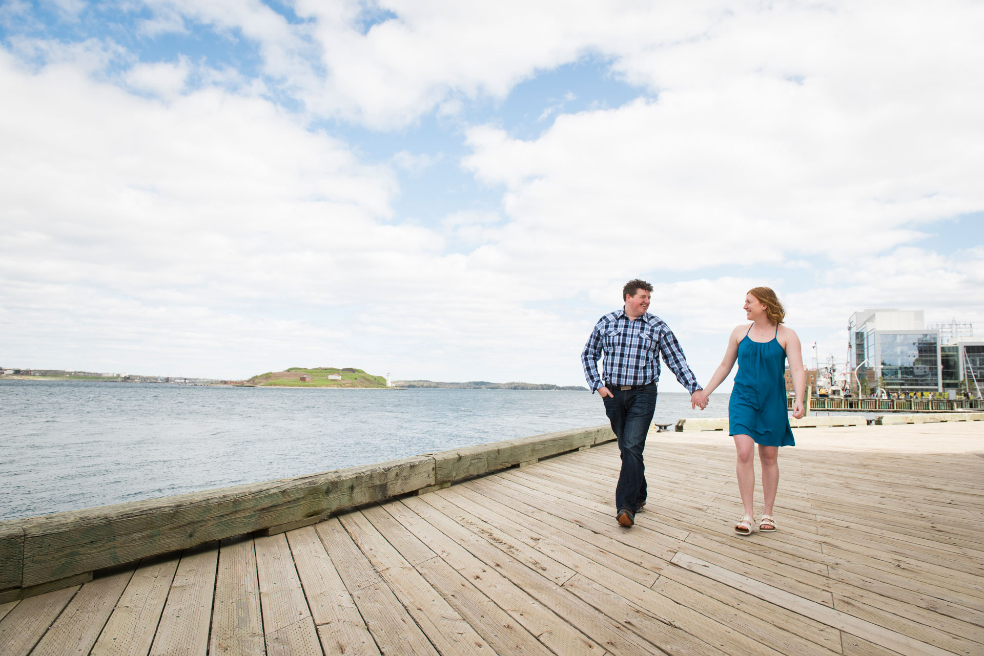 Couple strolling downtown Halifax boardwalk