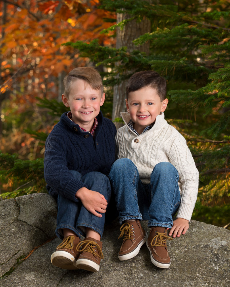 Brothers sitting on a rock family photography